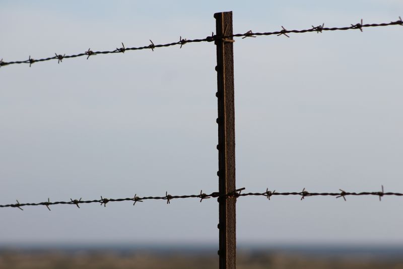 Security Fence with Barbed Wires